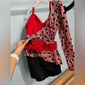 Red and black polka dot dance costume with flower belt
